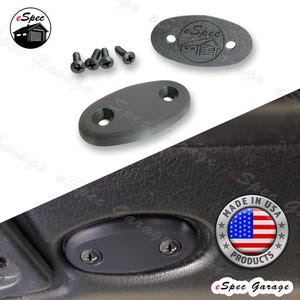 May include: Black oval-shaped automotive parts with two screw holes, alongside black screws. One part has the "eSpec Garage" logo. The image also includes a "Made in USA Products" sticker.