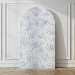 May include: A white archway backdrop with a blue floral pattern. The archway is made of a lightweight material and is ideal for creating a whimsical backdrop for photoshoots or events.