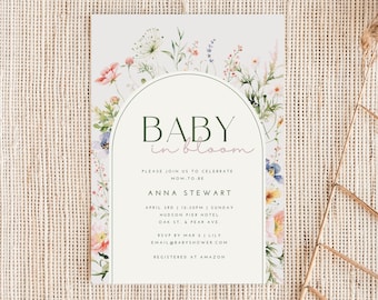 May include: A floral baby shower invitation with a watercolor design of flowers and greenery. The text reads "BABY in bloom" and includes the details of the event, including the date, time, location, and RSVP information.