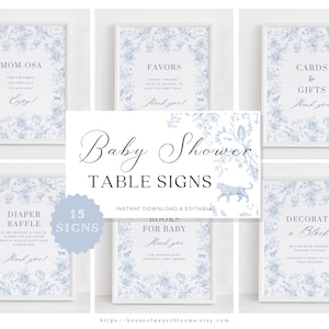 May include: A set of 15 printable baby shower table signs featuring a blue and white floral design. The signs include titles such as "Mom-osa", "Favours", "Cards & Gifts", "Diaper Raffle", "Books for Baby", and "Decorate a Block".