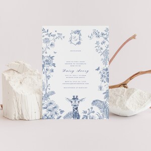 May include: Blue and white baby shower invitation with a floral border and a giraffe illustration. The invitation reads "Join us for a baby shower to celebrate the mom-to-be Daisy Avery Aug 17, 2024 at 1:00PM Hudson Pier Hotel RSVP by July 1st [website] Register at [website]"