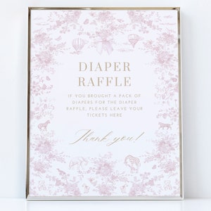 May include: A pink and white sign with a floral pattern and a silver frame. The sign says "Diaper Raffle" and "If you brought a pack of diapers for the diaper raffle, please leave your tickets here. Thank you!"
