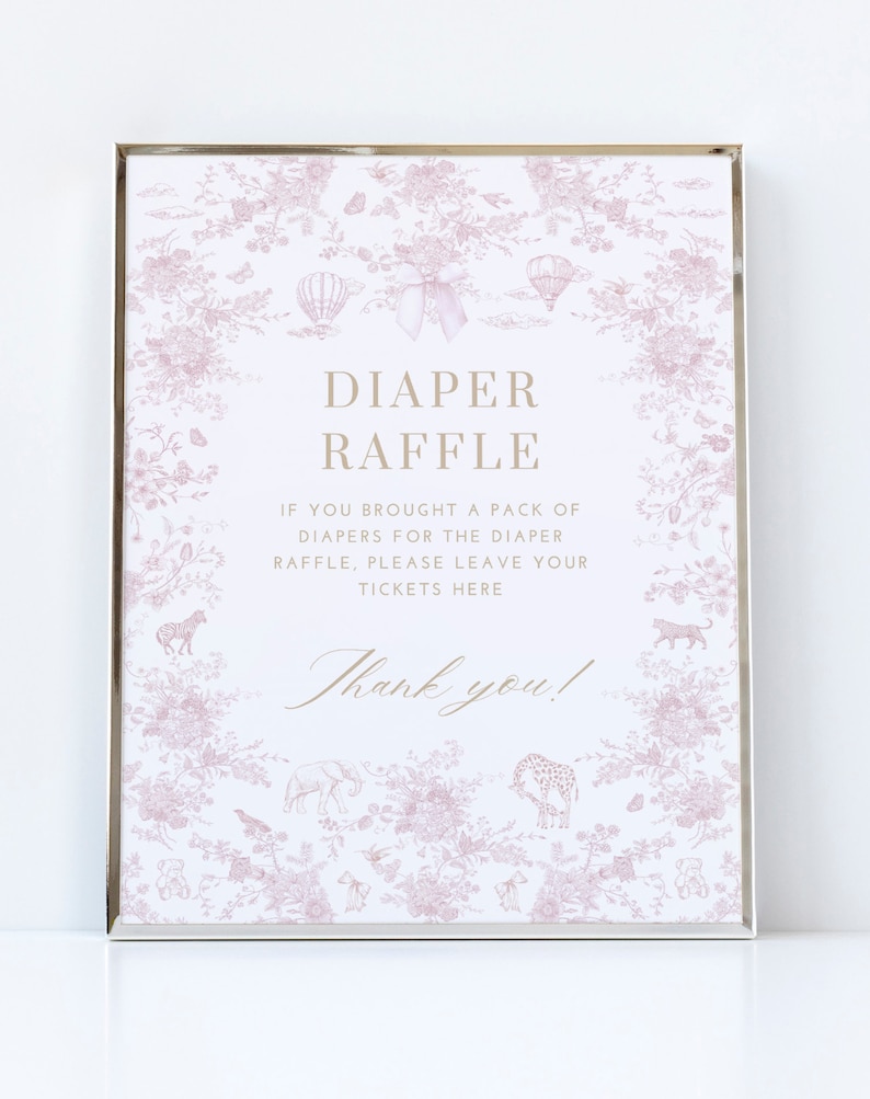 May include: A pink and white sign with a floral pattern and a silver frame. The sign says "Diaper Raffle" and "If you brought a pack of diapers for the diaper raffle, please leave your tickets here. Thank you!"