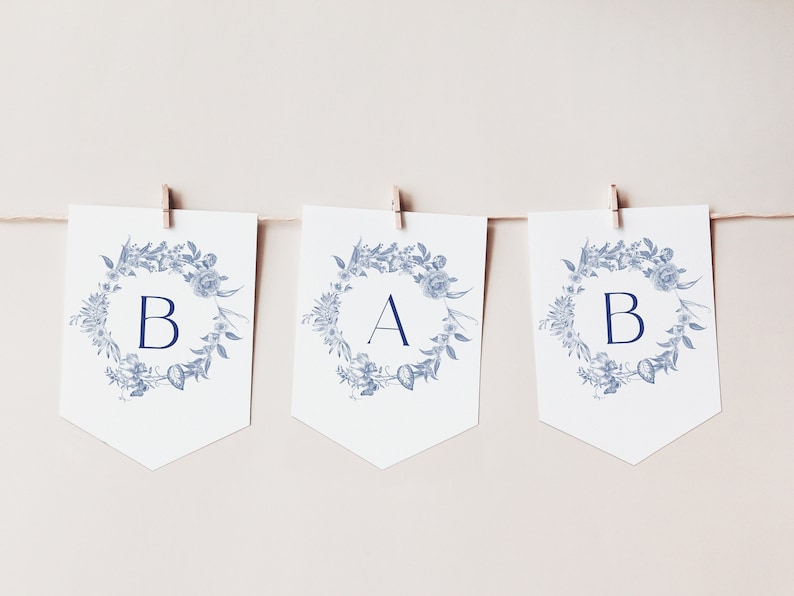 May include: A blue and white floral banner with the letters "B A B" in a navy blue font.