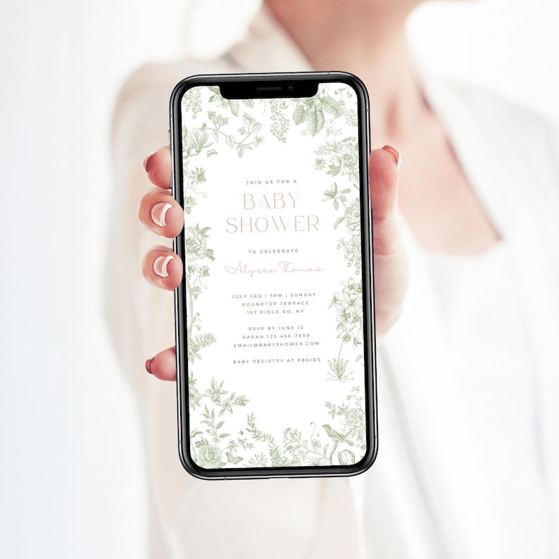 May include: A digital invitation for a baby shower with a green floral border. The invitation reads "Join us for a Baby Shower to celebrate Alyssa Thomas. July 3rd 1 PM | Sunday Bound Top Terrace 1st Ridge Rd, NY RSVP by June 12 Sarah 123.456.7890 emailbabyshower.com Baby Registry at Period"