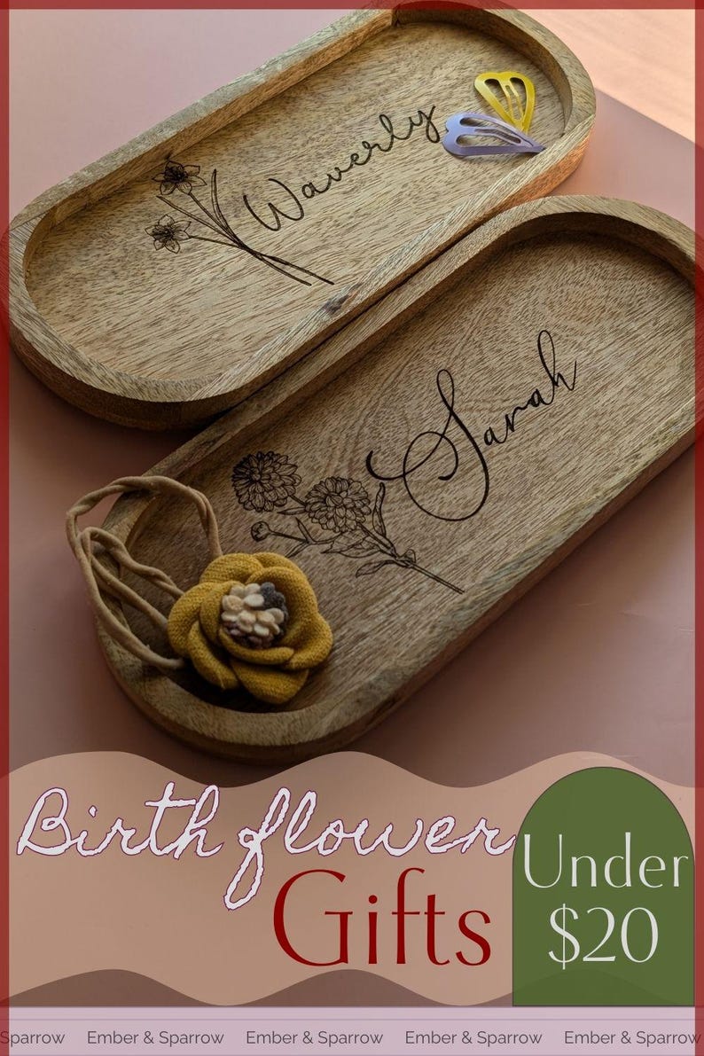 May include: Two wooden oval trays with engraved names "Waverly" and "Sarah" and floral designs. The trays are part of a set of birth flower gifts under $20.