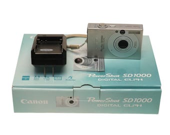 Cámara digital Canon PowerShot Digital ELPH SD1000 de 7,1 MP - Plateada, probada