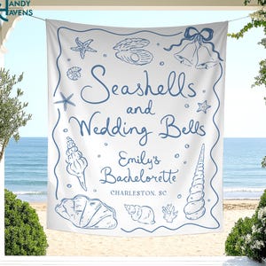 May include: White fabric banner with blue illustrations of seashells, starfish, and wedding bells. Text reads "Seashells and Wedding Bells, Emily's Bachelorette, Charleston, SC."