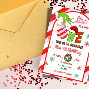 May include: A festive birthday invitation with a Grinch theme. The invitation features red and white stripes, green accents, and the text "She is a sweet ONE." An envelope and star-shaped confetti are also visible.