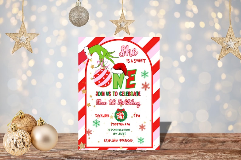 May include: A festive invitation for Elsa's 1st birthday, featuring a Grinch-themed design with red and green accents. The invitation includes the text "She is a sweet ONE" and details for the party on December 24th.