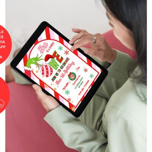 May include: A digital invitation on a tablet featuring a Grinch-themed design. The invitation includes text that reads "She is a Sweet One" and "Join us to celebrate her 1st Birthday". The design incorporates red, green, and white colors.