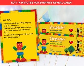 May include: A yellow surprise reveal card and tickets with a colorful brick theme. The card reads "Dear Elijah, Surprise! You and your family are going to Bricks theme park!" The tickets say "Surprise!" and "You're going to WRITE THEME PARK HERE."