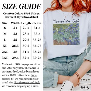 May include: White unisex sweatshirt with a size chart and a graphic of Vincent van Gogh's Irises. The sweatshirt is made of 80% ring-spun cotton and 20% polyester. The size chart shows the width, length, and sleeve length in inches for sizes S through 3XL.