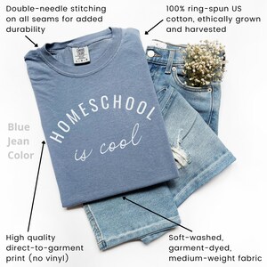 May include: A blue t-shirt with the text "HOMESCHOOL is cool" printed on it. The shirt is made of 100% ring-spun US cotton and is soft-washed, garment-dyed, and medium-weight.