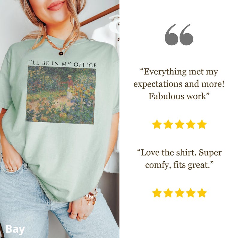 May include: A light green t-shirt with the text "I'LL BE IN MY OFFICE" above a colorful impressionist painting. The shirt is worn by a person. The image also includes customer reviews with five-star ratings.
