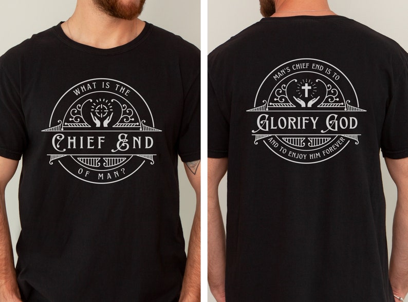 May include: Black t-shirt with a white circular design on the front and back. The front design reads "WHAT IS THE CHIEF END OF MAN?" with a cross and hands raised in prayer. The back design reads "MAN'S CHIEF END IS TO GLORIFY GOD AND TO ENJOY HIM FOREVER" with a cross and hands raised in prayer.