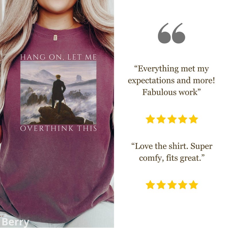 May include: Burgundy t-shirt with a painting of a man standing on a rock in the clouds. The text "Hang on, let me overthink this" is printed on the shirt.