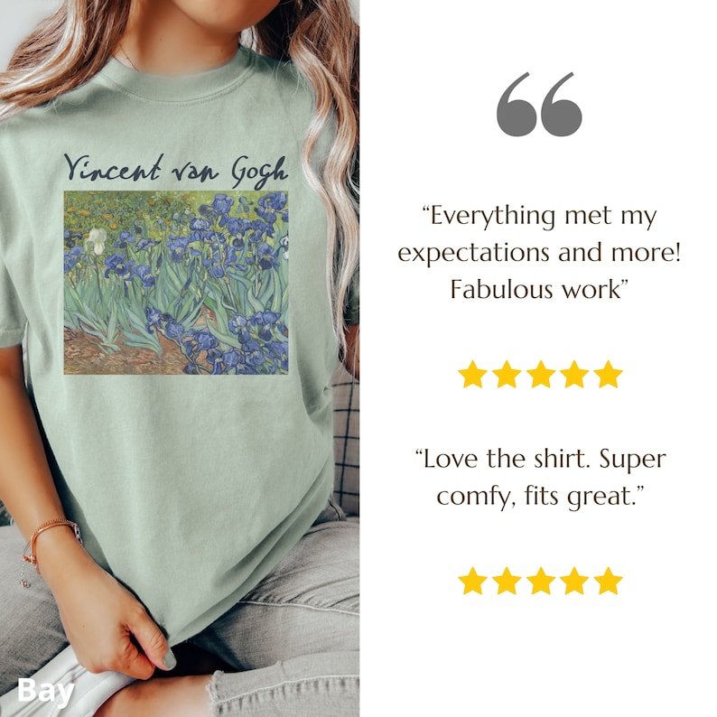 May include: A sage green t-shirt featuring a printed reproduction of Vincent van Gogh's Irises painting with the artist's name in black text above the artwork. The shirt includes two five-star reviews with text quotes about the product quality.