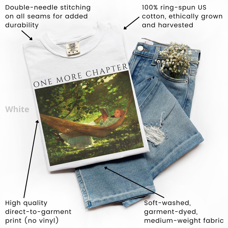 May include: A white t-shirt with the text "ONE MORE CHAPTER" and a graphic of a person in a hammock. The shirt is paired with light blue denim jeans. The shirt is made of 100% ring-spun US cotton and has double-needle stitching.