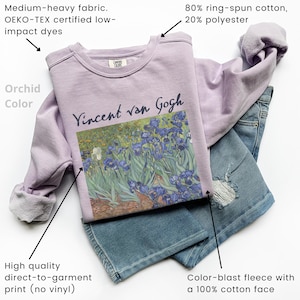 May include: A lavender sweatshirt with a print of Vincent van Gogh's Irises painting. The sweatshirt is made of a soft, comfortable fleece fabric and is 80% ring-spun cotton and 20% polyester.