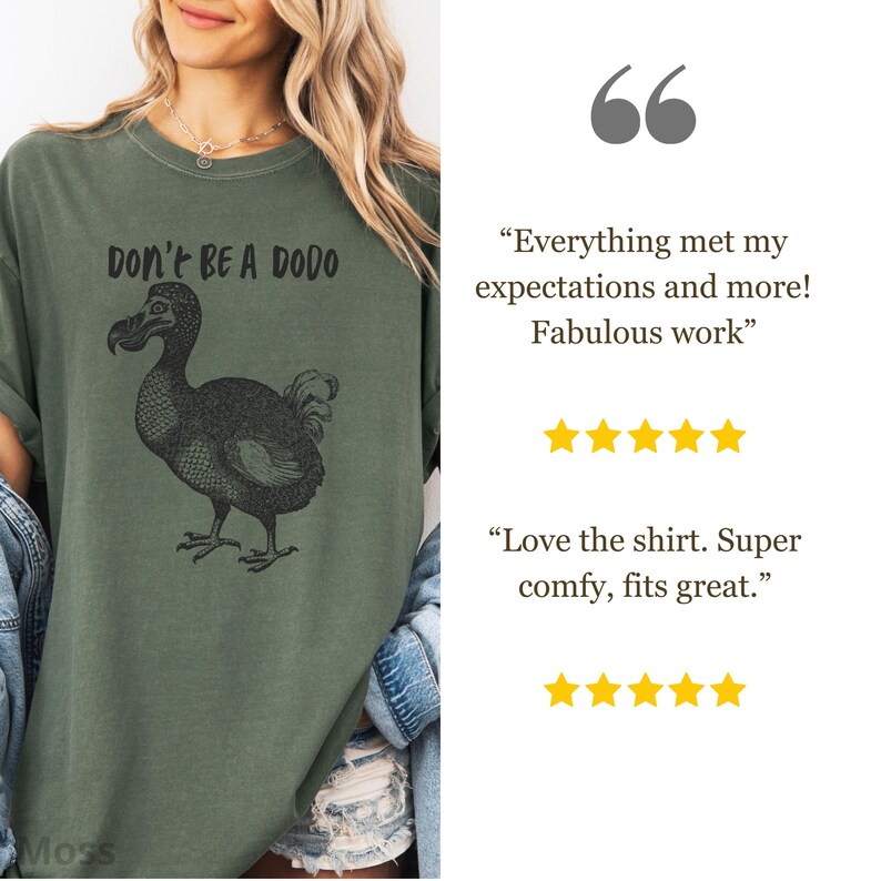 May include: Olive green t-shirt featuring a black illustration of a dodo bird and the text "DON'T BE A DODO". The shirt has a relaxed fit and short sleeves. The shirt is made of a soft, comfortable material.