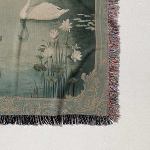 a tapestry with a swan and flowers on it