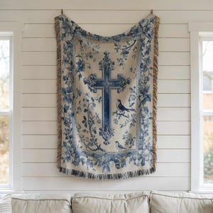a blue and white tapestry hanging on a wall