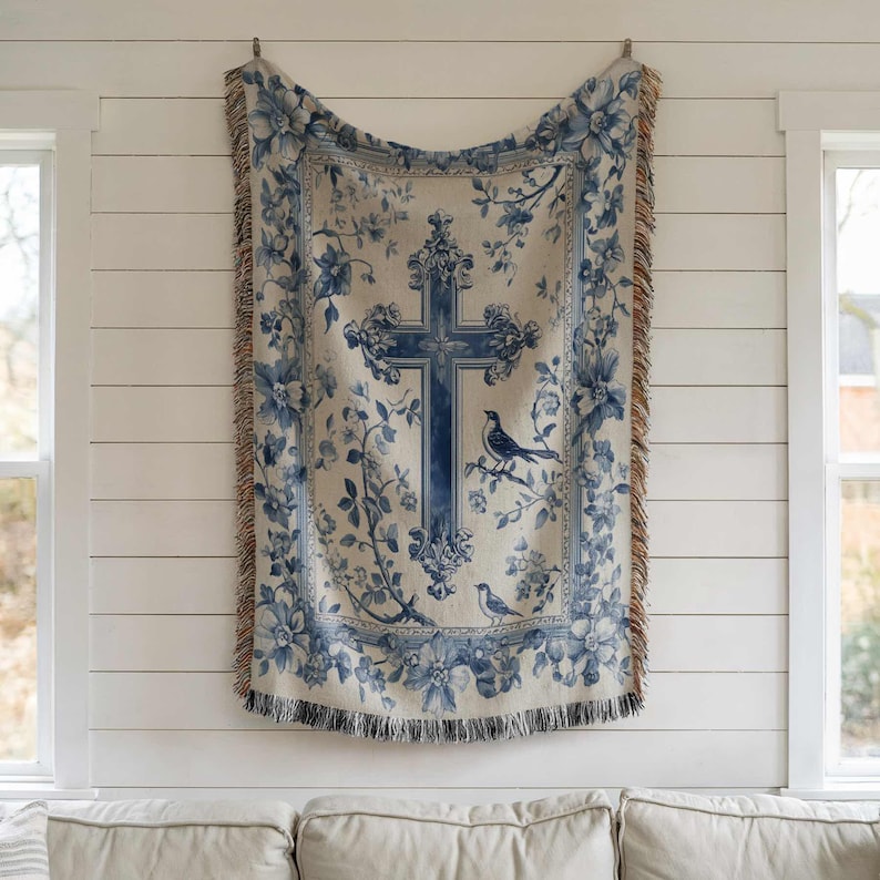 a blue and white tapestry hanging on a wall