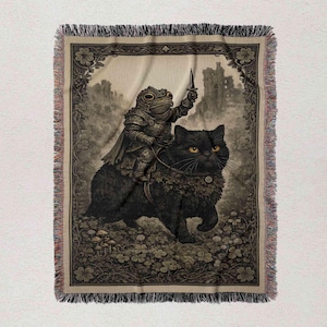 a black cat riding on the back of a frog, both wearing armor and holding swords.