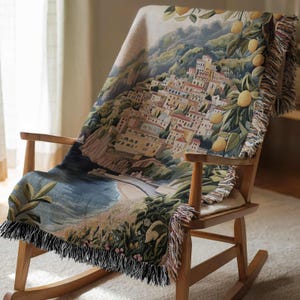 a rocking chair with a blanket on top of it