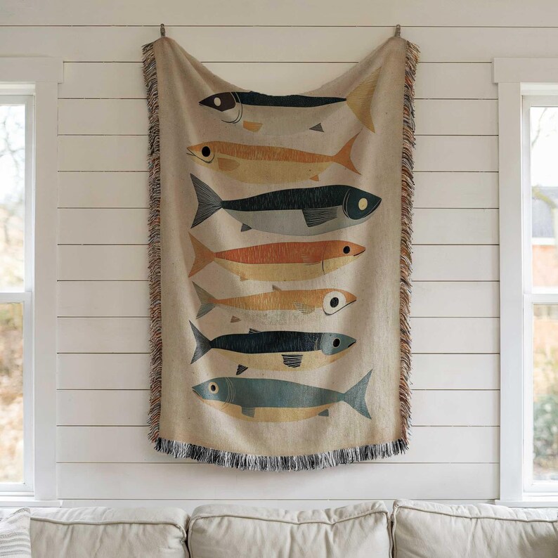 a tapestry hanging on a wall with fish on it