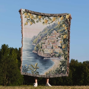 a person standing in front of a large tapestry