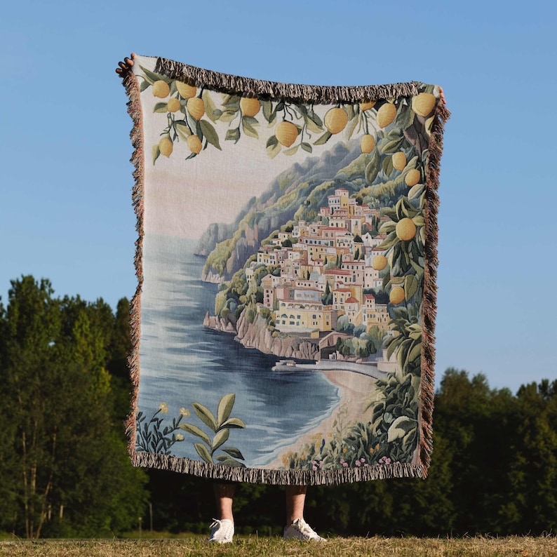 a person standing in front of a large tapestry