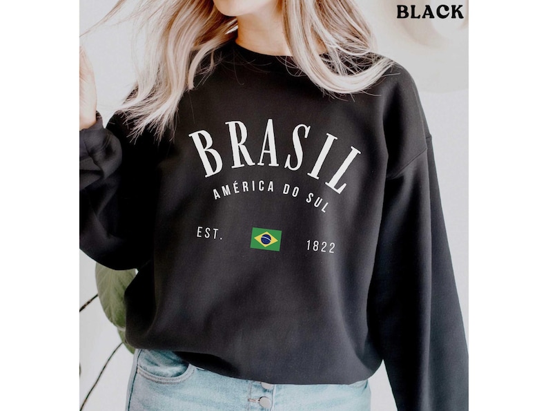 a woman wearing a black sweatshirt with the words brasil printed on it