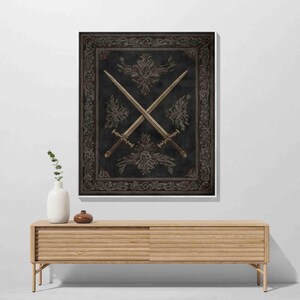 a wooden cabinet with a vase and a small plant on top, and a framed artwork of crossed swords hanging on the wall above it.