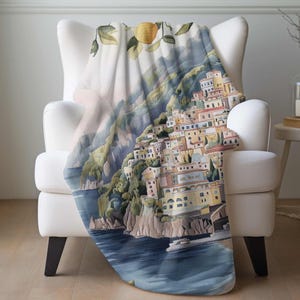 a white chair with a blanket on it