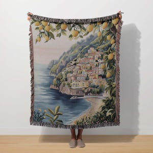 a woman standing in front of a tapestry