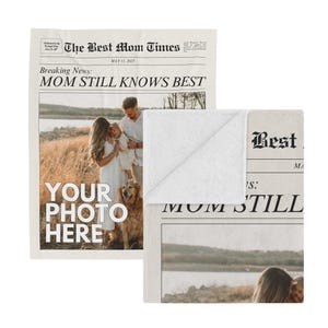 a newspaper with a picture of a couple and their dog