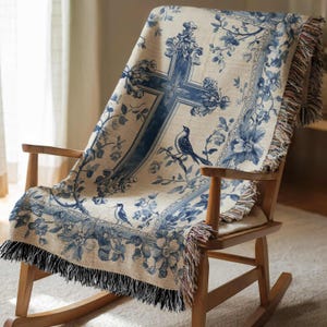 a rocking chair with a blue and white blanket on it