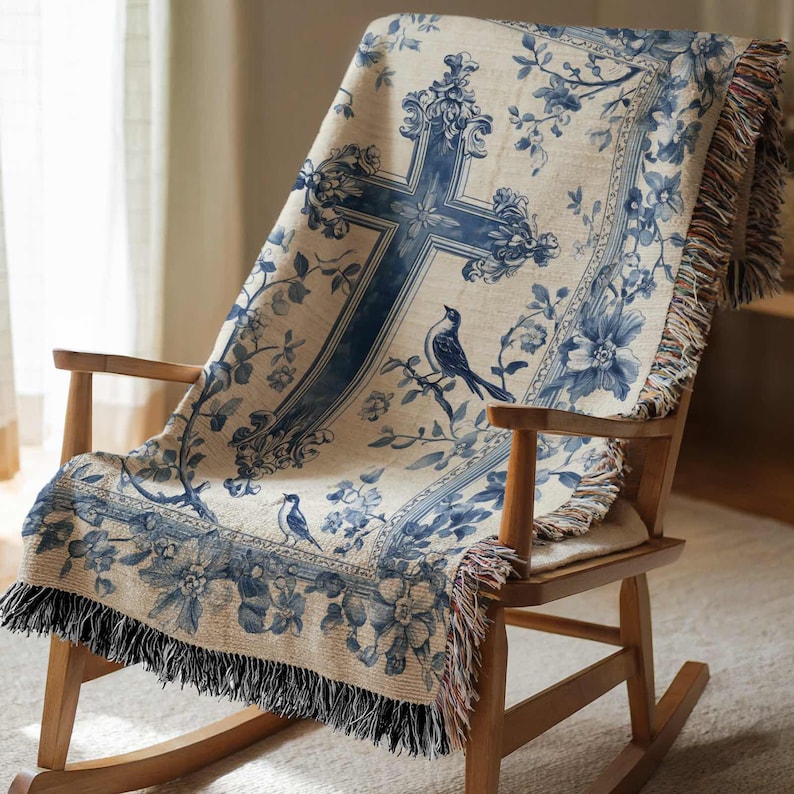 a rocking chair with a blue and white blanket on it