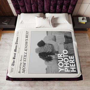 a bed with a large poster on the side of it