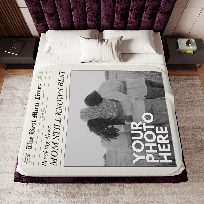 a bed with a large poster on the side of it
