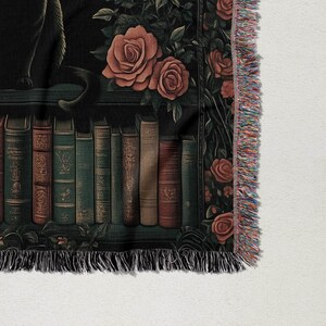 a tapestry of books and roses on a shelf