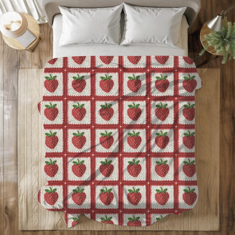 a bed covered in a red and white quilt
