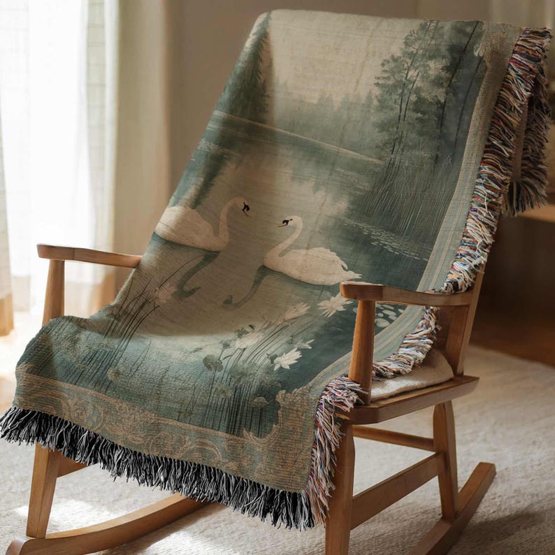 a rocking chair with a blanket on top of it