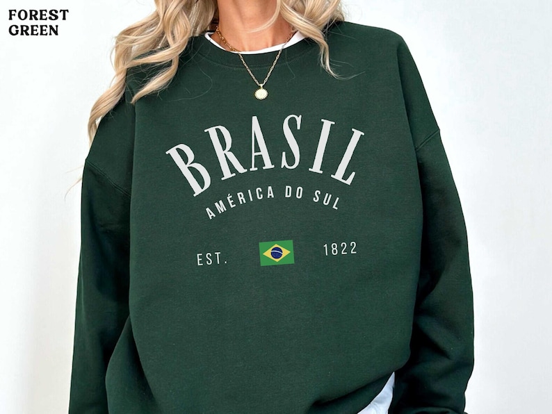 a woman wearing a green sweatshirt with the words brasil on it