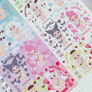 May include: A set of colorful sticker sheets featuring cartoon characters with different expressions and poses. The stickers are arranged in rows on a spiral bound notebook. The stickers are on a white background and have a glossy finish. The text on the sticker sheet reads "OMW TO SAVE UR ASS".