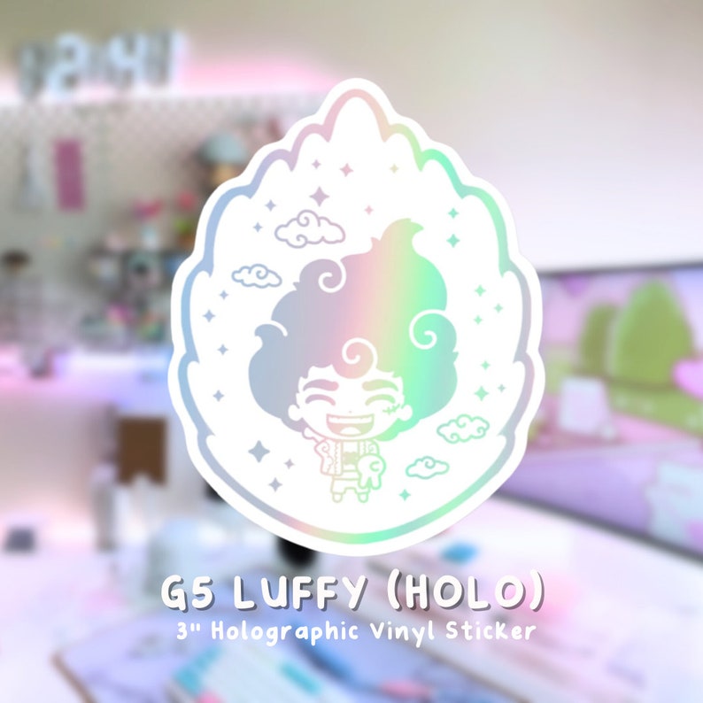 May include: A holographic vinyl sticker featuring a cartoon character with a cloud-like design. The sticker is 3 inches in diameter and features a character with a big smile and a cloud-like design. The sticker is holographic and has a rainbow effect.