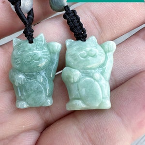 Natural A-grade jadeite, hand-carved lucky cat. Cute shape, light green.