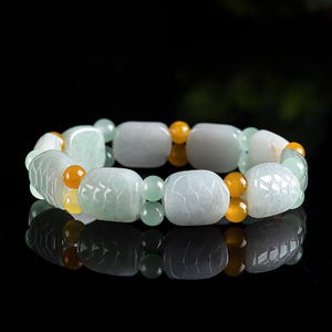 Naturalny jadeit Bransoletka materiałowa, 100% naturalna. Oznacza, że szczęście jest zawsze obecne, a szczęście do bogactwa jest pomyślne